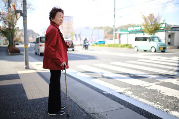 istock Senior woman crossing 1132356450