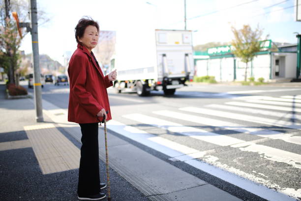 istock Senior woman crossing 1132356452