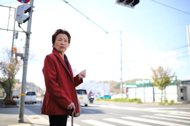 istock Senior woman crossing 1132356454