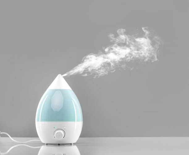 humidificador de aire blanco-azul. - humidifier steam home interior appliance fotografías e imágenes de stock