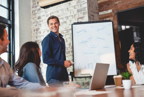istock Business people watching a presentation on the whiteboard. 1132357328
