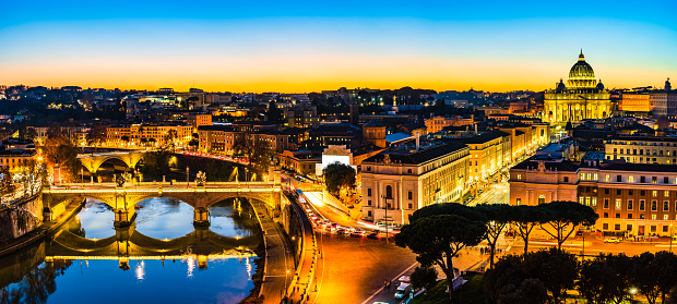 Vatican, Rome, Italy: Night landscape of St. Peter's Basilica, the Tiber river and the Victor Emmanuel II (Vittorio Emanuele II) bridge.