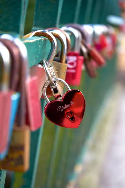Love locks on bridge railings in Romberkpark Dortmund