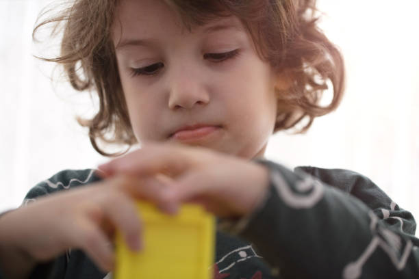 istock Happy child playing with Preschoolers Building Blocks 1132361468