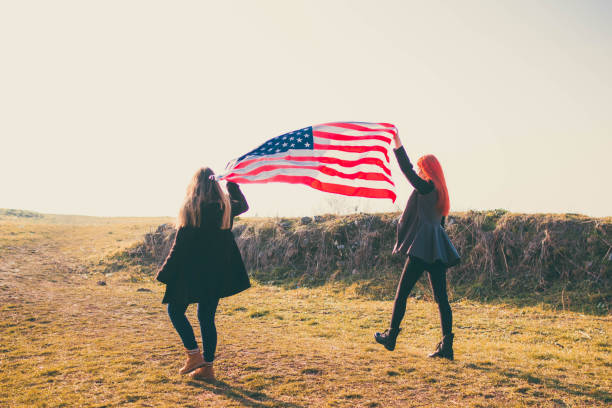 istock Two girls with USA flag 1132367450