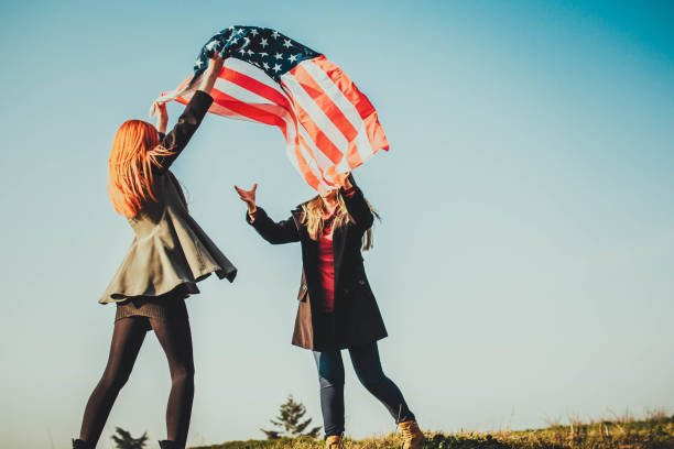 istock Two girls with USA flag 1132367456