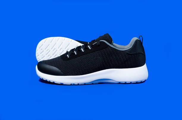 istock sneakers isolated on light blue background, fashion 1132371153