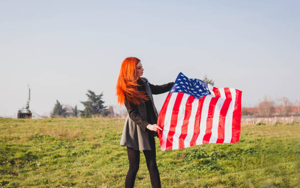 istock Woman with USA flag 1132371603