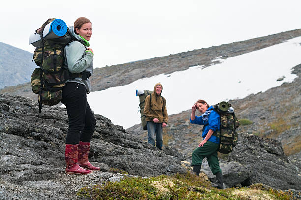 istock Tired team of backpackers in mountains 113237206