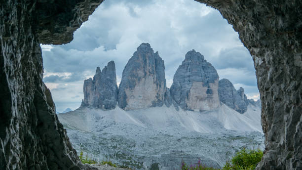 istock Tre Cime - Three Peaks seen from the rocky cave 1132373143