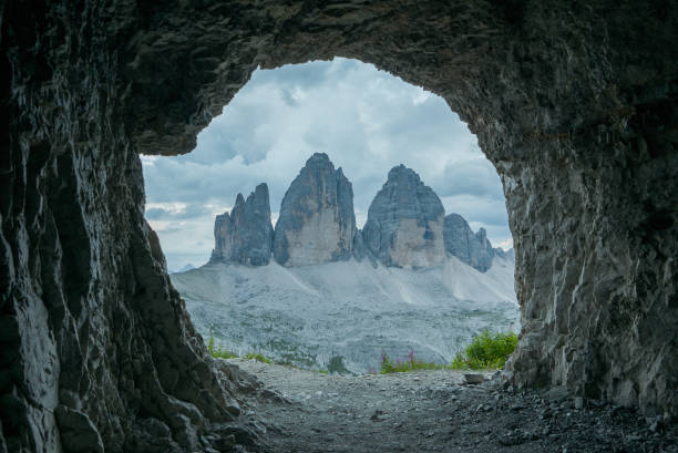 istock Tre Cime - Three Peaks seen from the rocky cave 1132373153