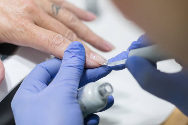 istock Close up on hands receiving manicure and nail polish 1132378185
