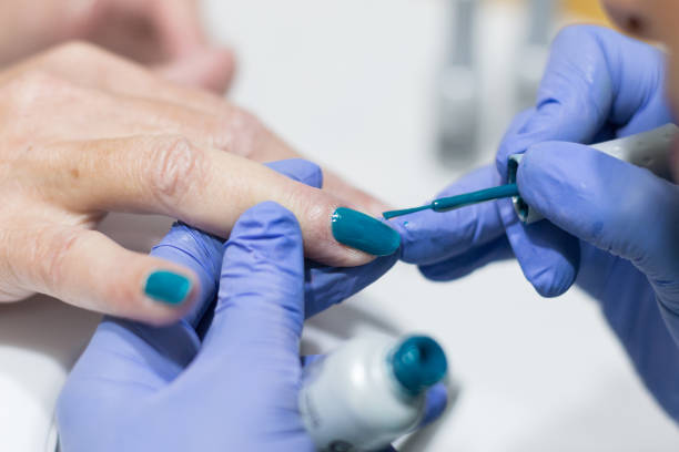 istock Close up on hands receiving manicure and nail polish 1132378192