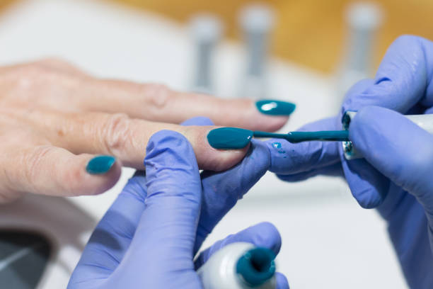 istock Close up on hands receiving manicure and nail polish 1132378352