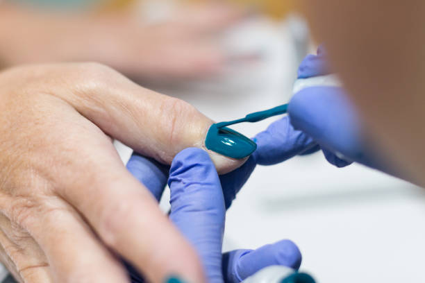 istock Close up on hands receiving manicure and nail polish 1132378363