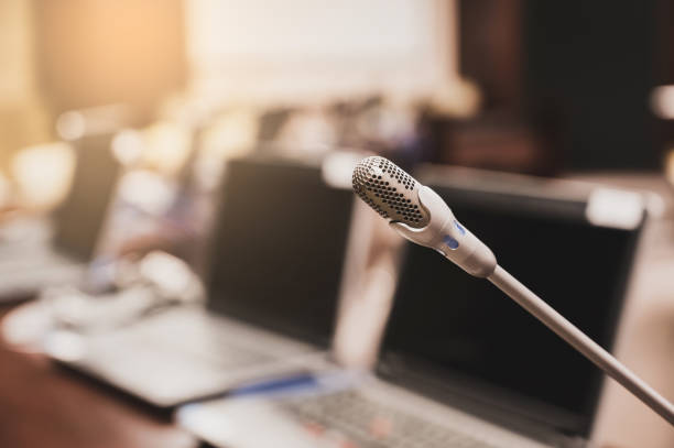 istock Microphone over the blurred business forum Meeting or Conference Training Learning Coaching Room Concept, Blurred background. 1132381613