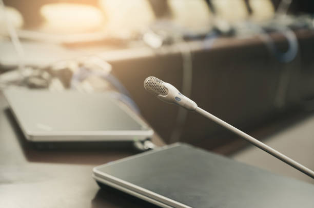 istock Microphone over the blurred business forum Meeting or Conference Training Learning Coaching Room Concept, Blurred background. 1132381632