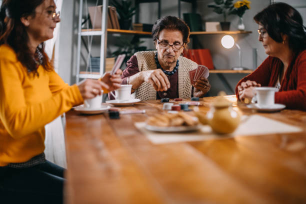 istock Active senior women playing games at home 1132381680