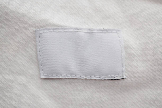 istock White blank clothing label on cotton shirt background 1132382105