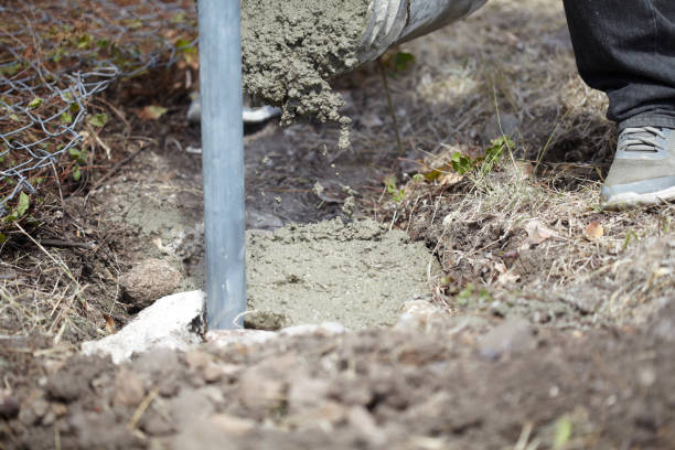 istock Afro Caribbean Man Making  A Fence Using Metal Poles 1132385985