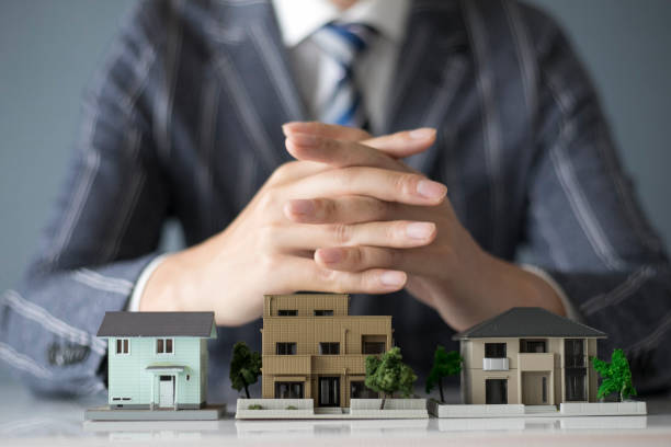 istock Businessman and home sales 1132386012