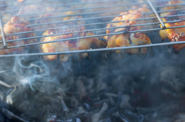 istock Grilled chicken leg over flames on a barbecue. 1132391125
