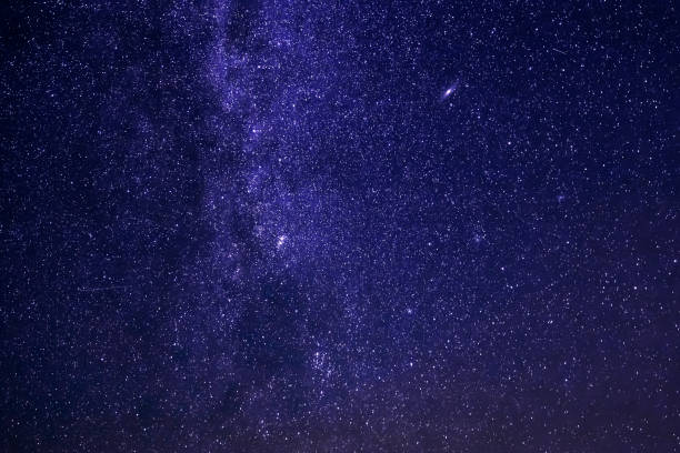 istock Milky way galaxy with glowing stars and planets in the universe 1132391941
