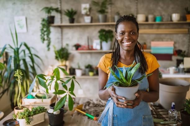 istock Florist Woman Seedling Plants 1132392164