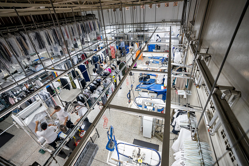 People working at an industrial laundry service - View from above