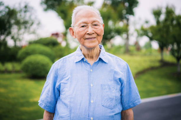 Portrait of a senior Chinese man Portrait of a senior Chinese man in a park. 90 plus years photos stock pictures, royalty-free photos & images