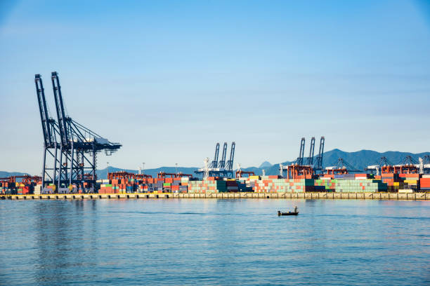 istock Industrial port container crane with a cruise ship 1132401992