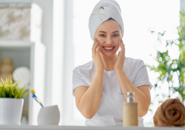 istock woman with cream for her face 1132402226