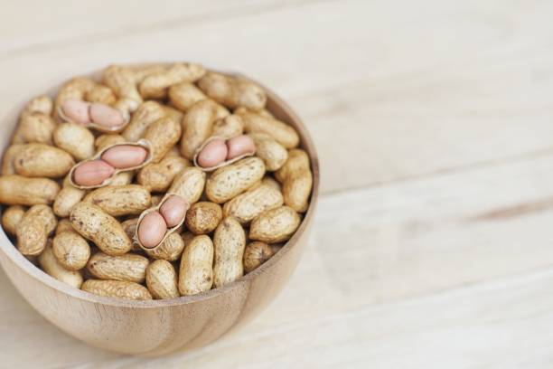istock Roasted peanut, snack, in classic wooden bowl, copy space 1132406703