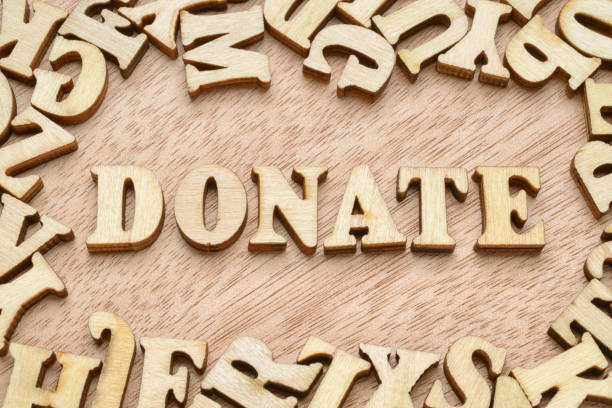 istock Donate wooden word 1132406862