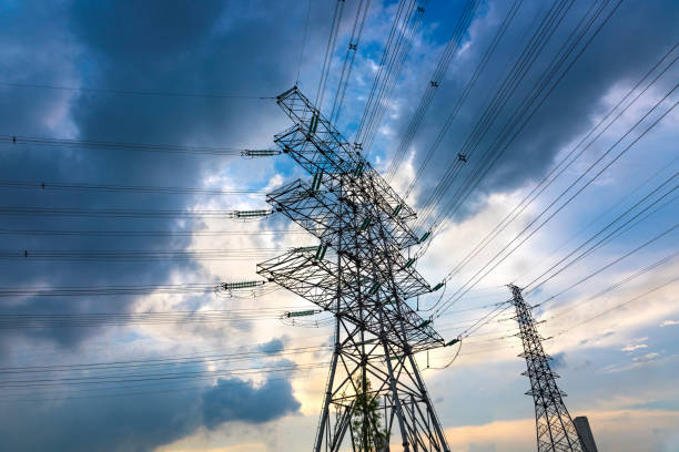 istock Large high voltage towers under the blue sky white clouds 1132409122