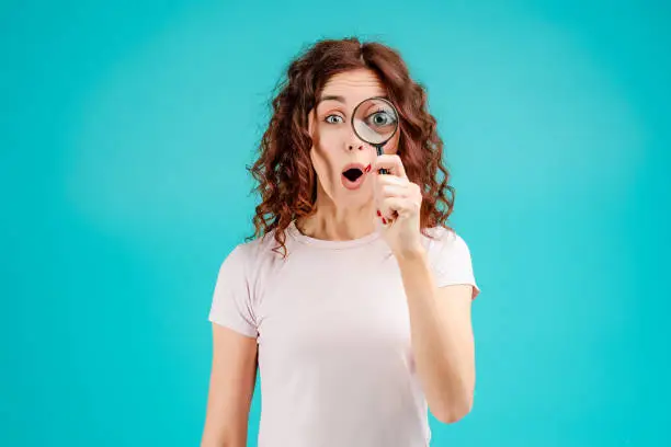 Photo of Young woman with curly hair isolated over bright colorful background