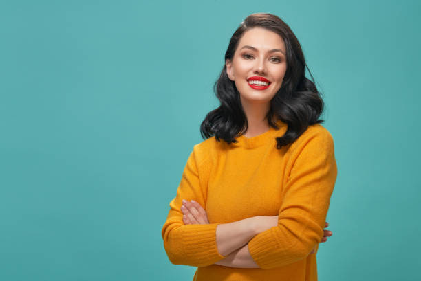 istock woman on teal background 1132411978