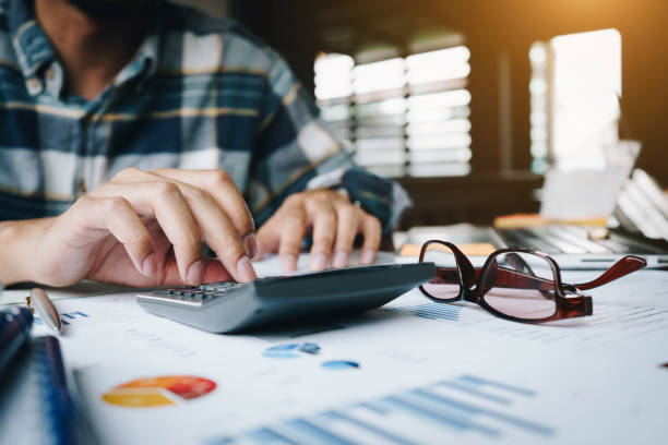 istock Businessman or accountant using smartphone working about financial document data.Accounting -tax documents. Business financial and accounting concept. 1132412839