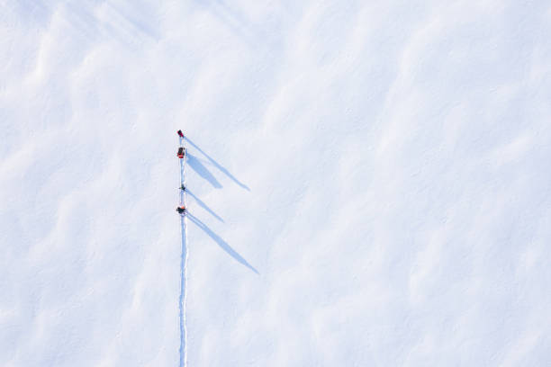 aerial view family schneeschuhwandern im winter nach schneesturm im freien - tranquil scene joy vacations high angle view stock-fotos und bilder