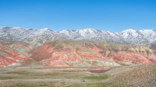 istock Snow covered amazing striped red mountains at winter 1132413866