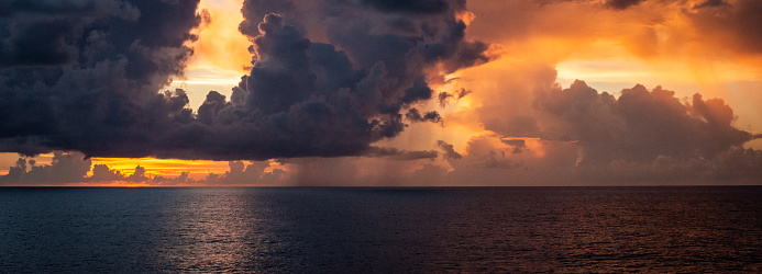 A colorful panoramic sky over the Caribbean sea.