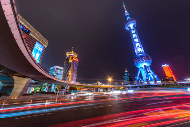 istock shanghai pedestrian bridge at night with light trails on the downtown 1132414946
