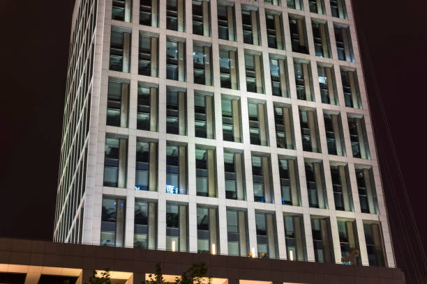 istock glass, windows.Part of the skyscraper at night 1132415525
