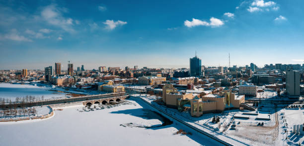 drone panoramic view of Chelyabinsk snow cityscape Aerial drone panorama; beautiful view Chelyabinsk city with white snowy streets and bridges; sunny winter day in South Ural capital; industrial and pollution problem; undeveloped urban environment shanghai cooperation organization stock pictures, royalty-free photos & images