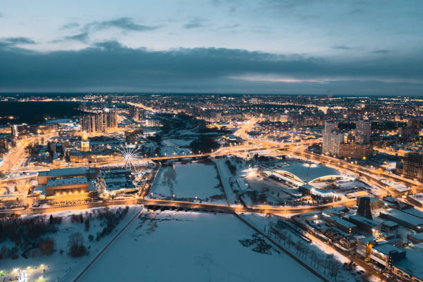 drone panoramic view of Chelyabinsk snow cityscape Aerial drone panorama; beautiful view Chelyabinsk city with illuminated streets and bridges at night; winter evening South Ural capital; industrial and pollution problem; undeveloped urban environment shanghai cooperation organization stock pictures, royalty-free photos & images