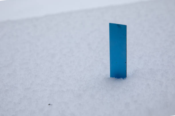 istock Blue Metal Ruler Inserted in the Snow 1132420543