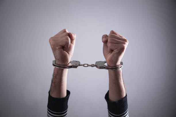 istock Man in handcuffs. Criminal concept 1132422385