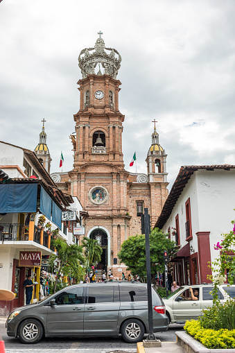Puerto Vallarta, Mexico - September 2018: Busy street in front of the Basilica Our Lady of Guadalupe in Downtown Puerto Vallarta.