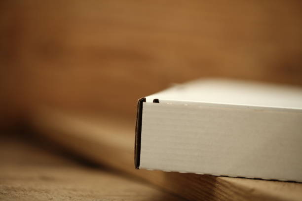 istock White cardboard box for pizza on a wooden table. 1132424671