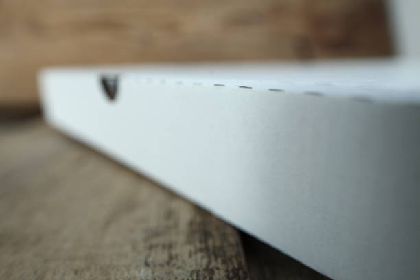 istock White cardboard box for pizza on a wooden table. 1132424716